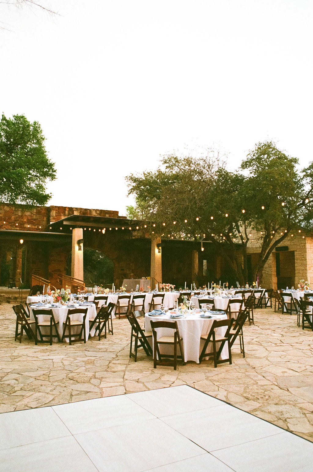 reception tables with flowers and decor outside at the Lady Bird Johnson Wildflower Center