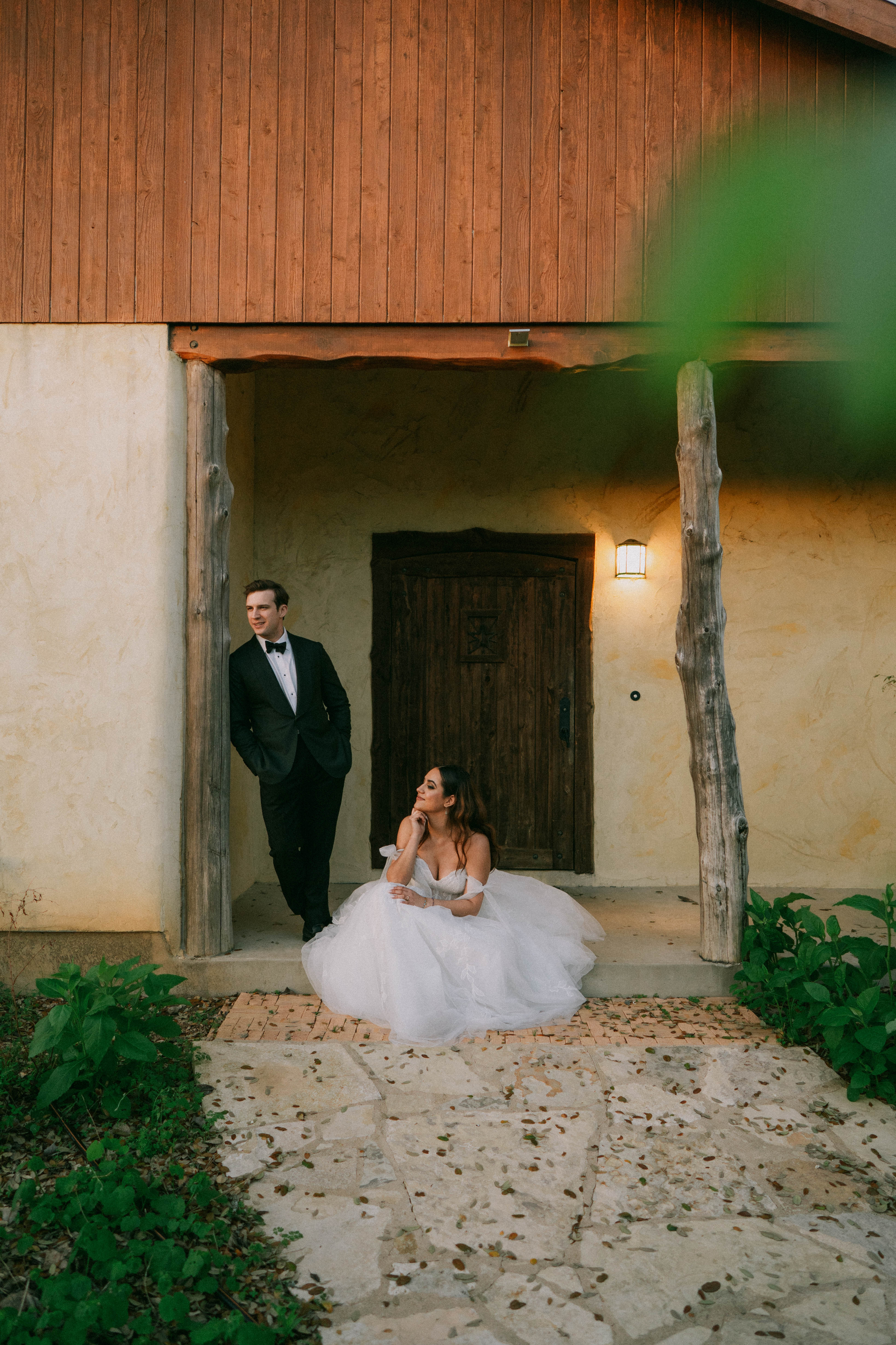 Bride and groom sitting on porch at Hudson Bend Ranch in Austin, Texas