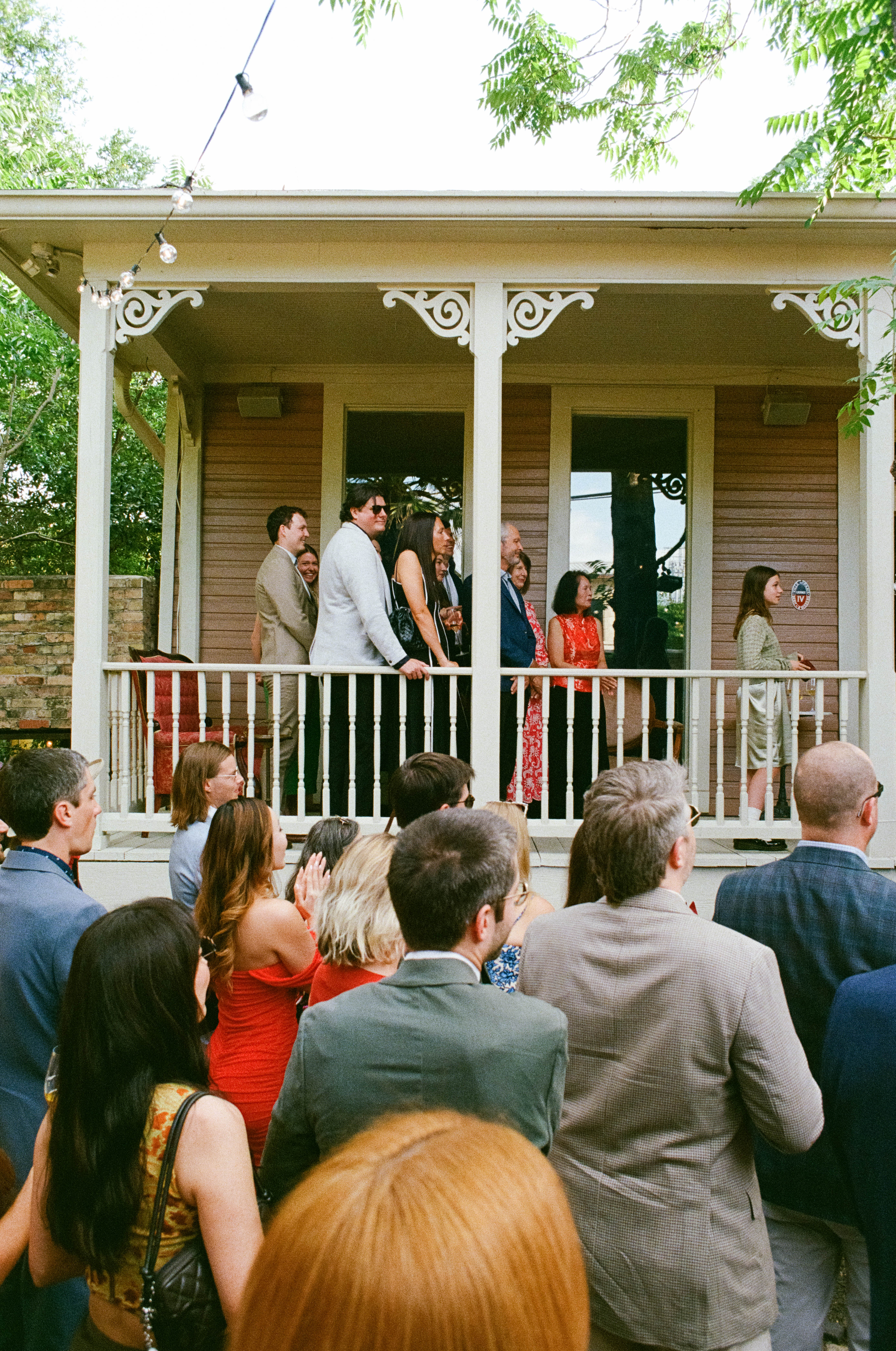 Guests watching wedding ceremony at Justine's Secret House in Austin, Texas