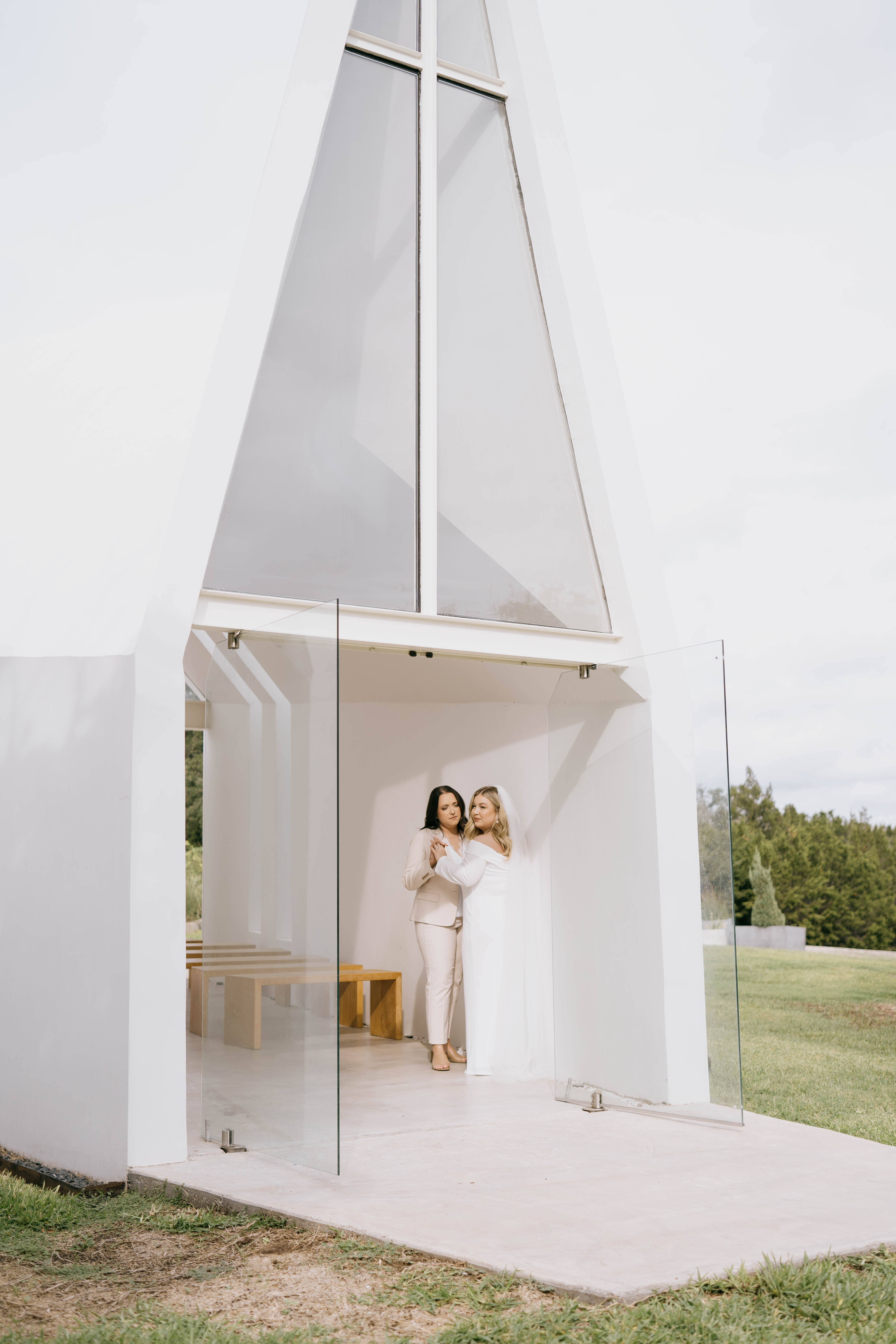 LGBTQ couple inside modern chapel in Austin, Texas