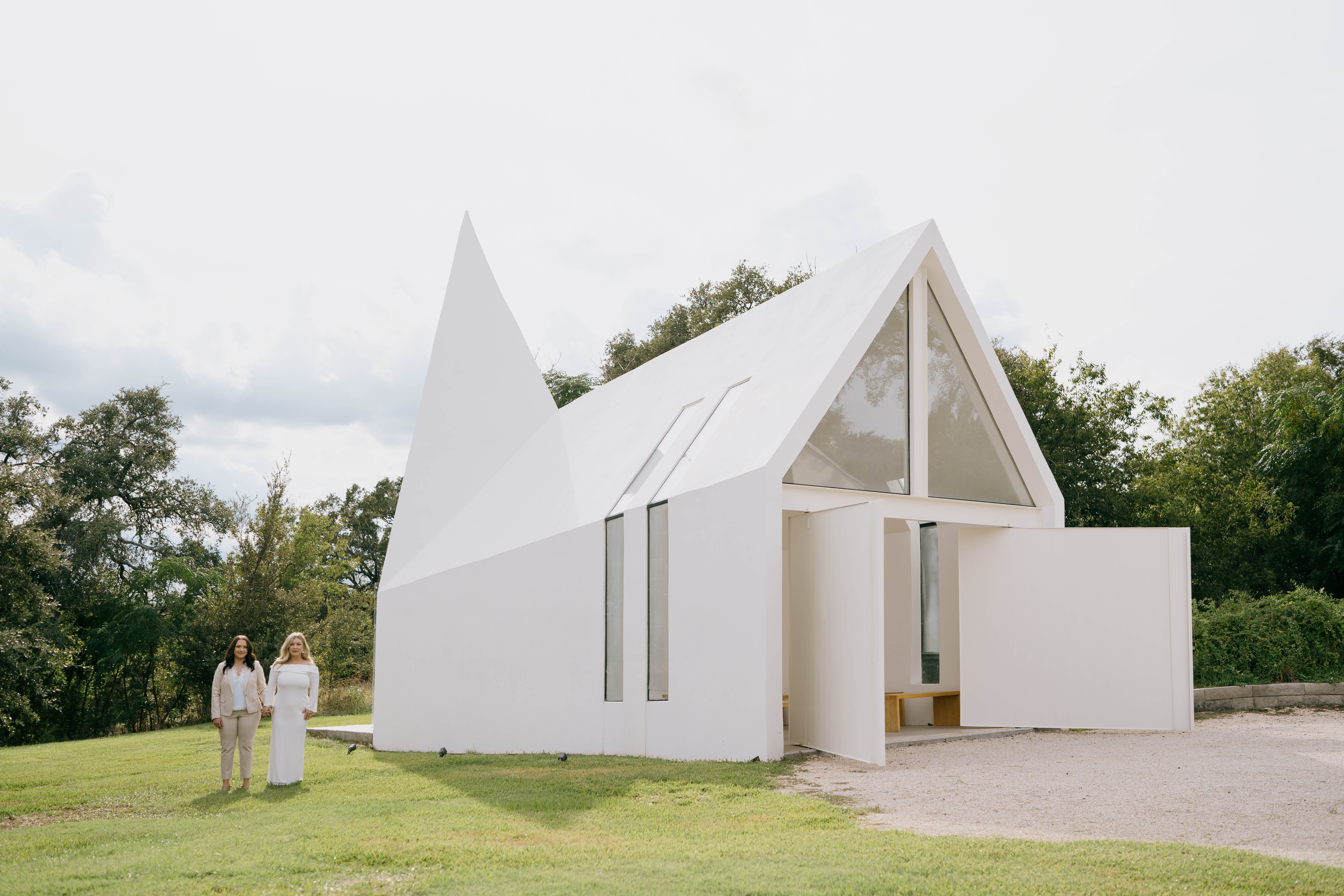 Brides standing outside of Lincoln Chapel in Georgetown, Texas