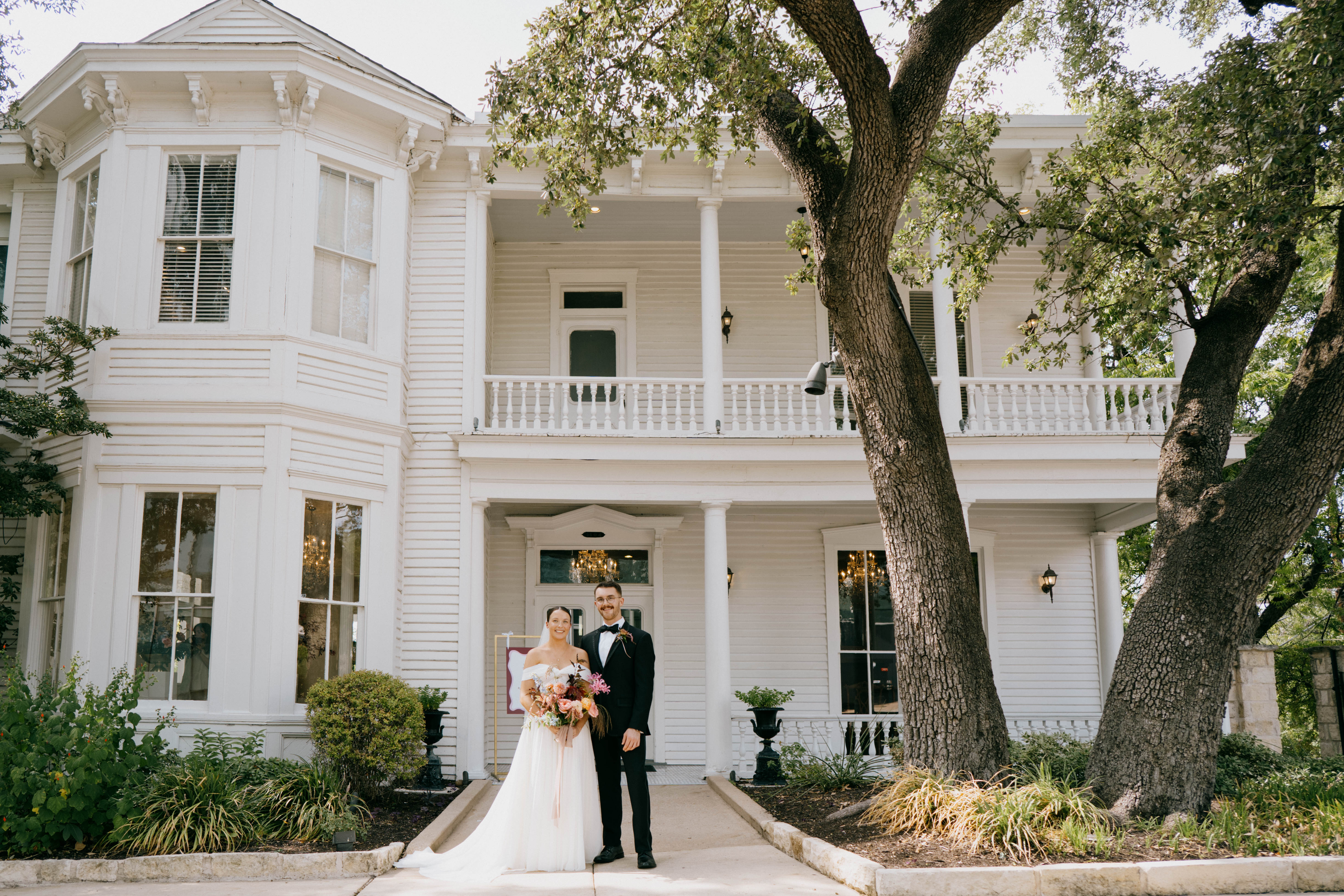 Bride and groom out front of Allan House in Austin, Texas