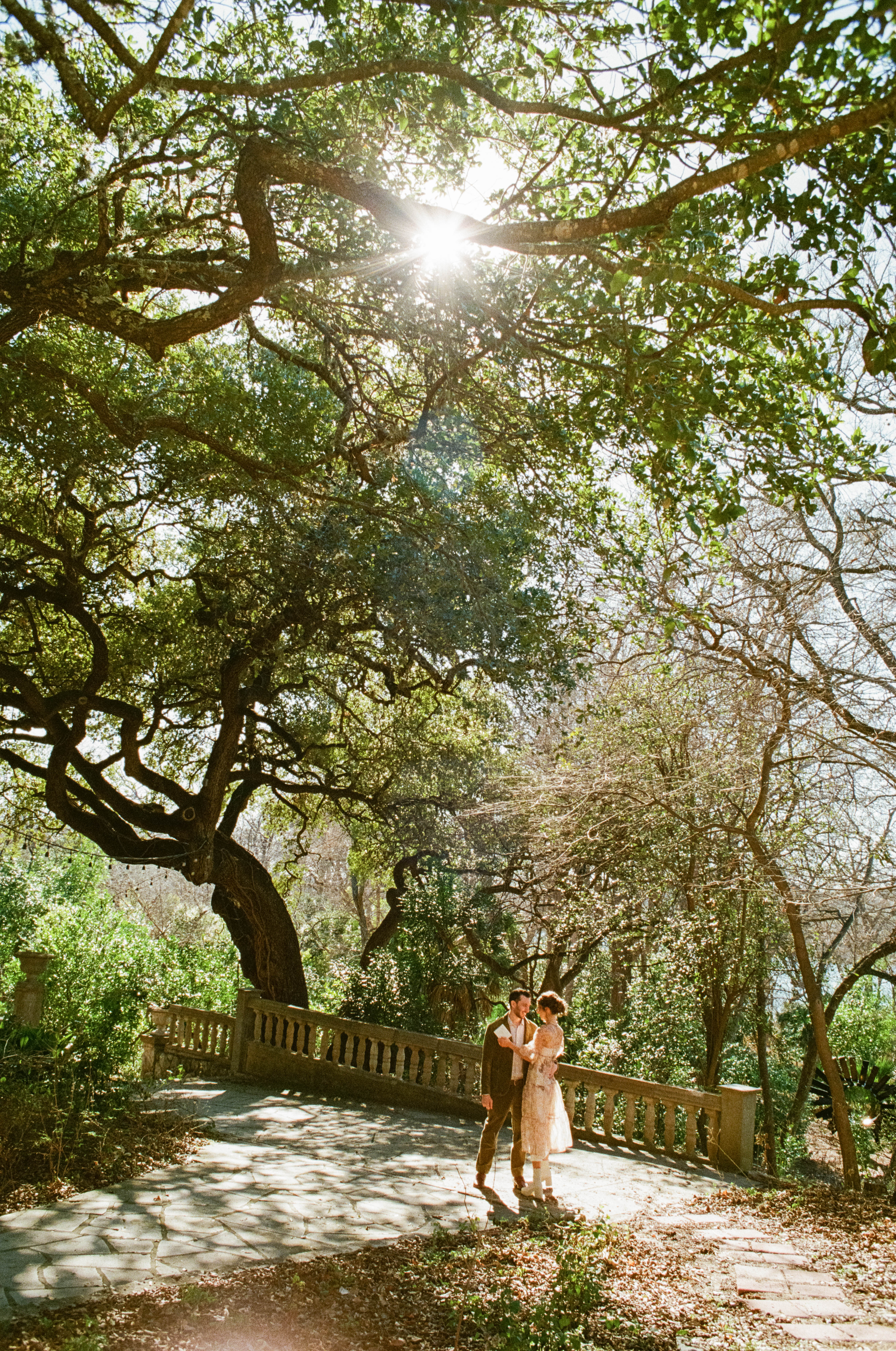 Couple under the trees of Laguna Gloria in Austin, Texas