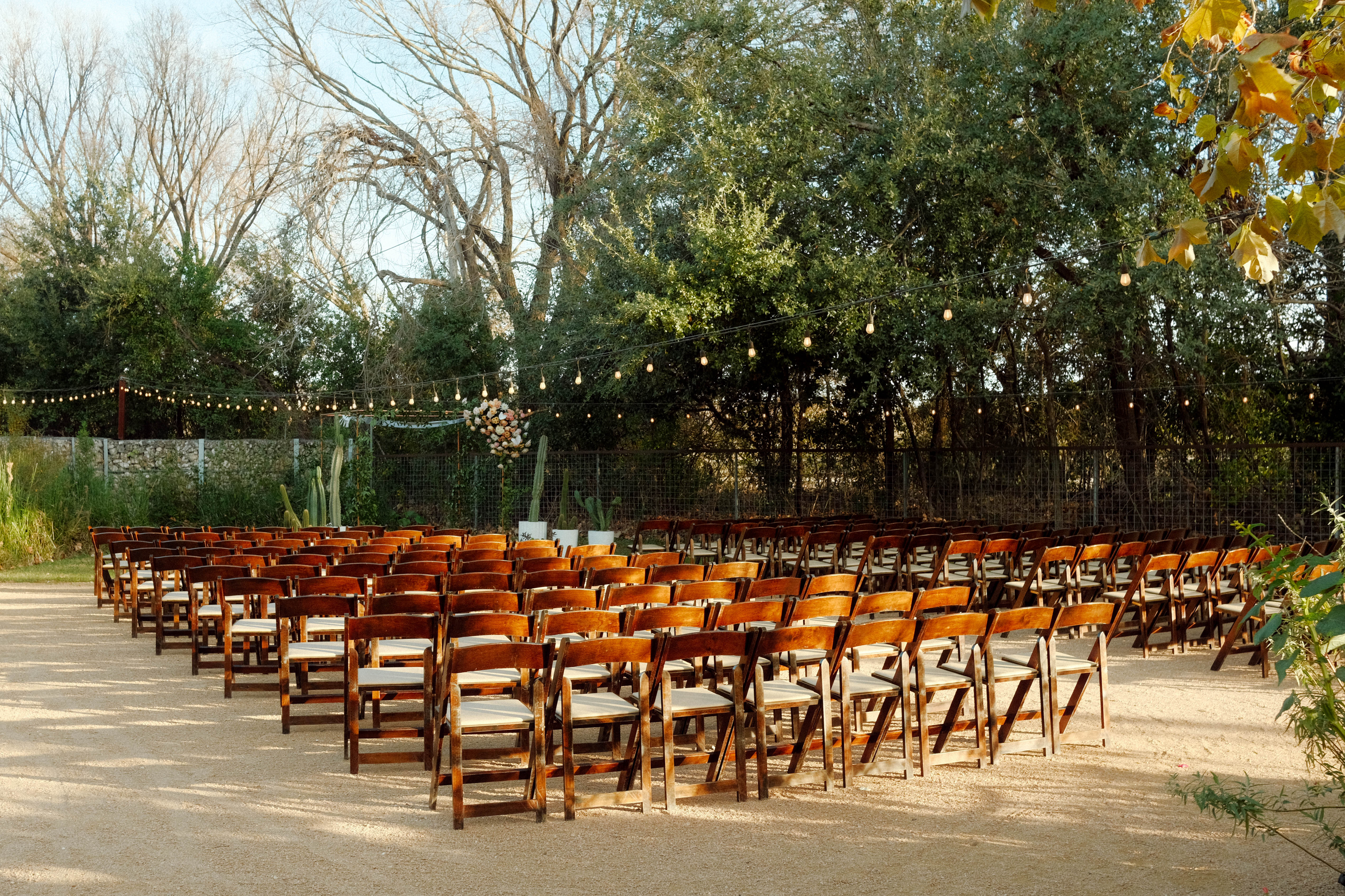 Ceremony setting in garden of Springdale Station in Austin, Texas
